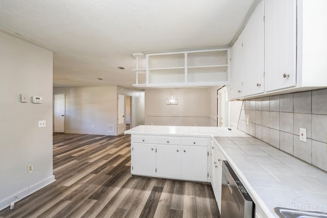 kitchen with white cabinetry, dishwasher, tile counters, dark hardwood / wood-style flooring, and decorative backsplash