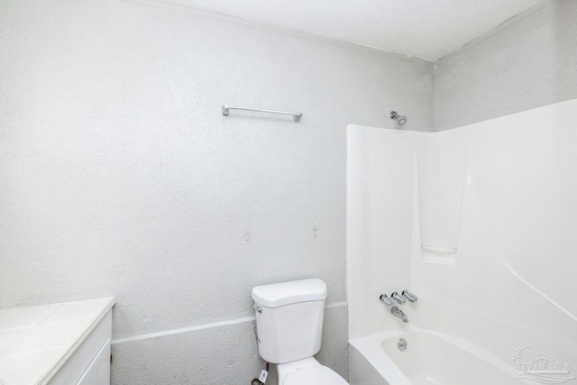 full bathroom with vanity, shower / bath combination, a textured ceiling, and toilet