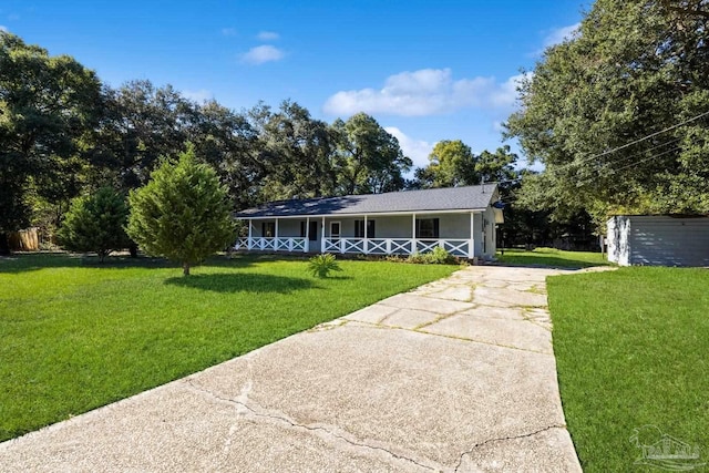 ranch-style house with a porch and a front yard