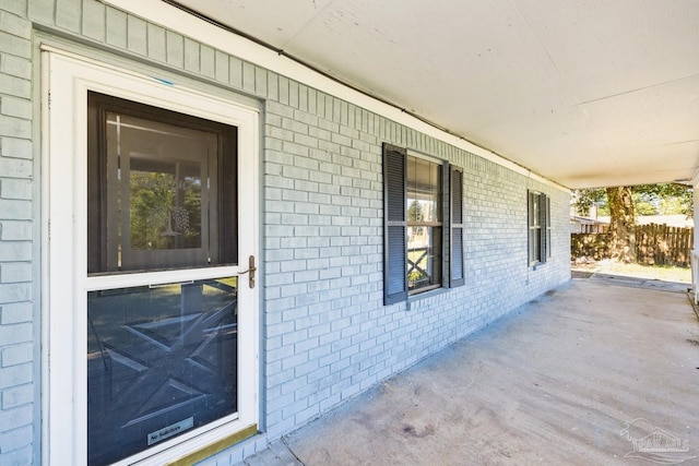 entrance to property featuring a porch