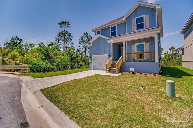 view of front of home with a porch, a garage, and a front lawn