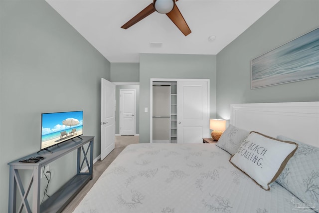 bedroom featuring baseboards, visible vents, a ceiling fan, and a closet