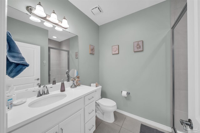 full bath featuring a tile shower, visible vents, toilet, vanity, and tile patterned flooring