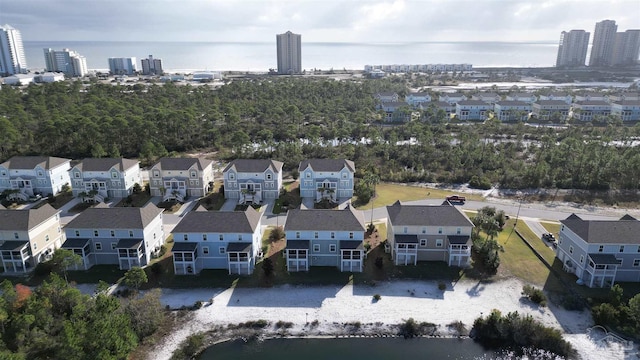 birds eye view of property with a residential view and a water view