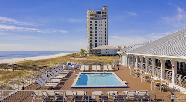 pool with a water view and a view of the beach