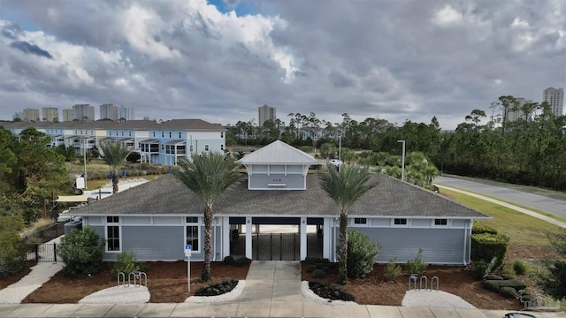 view of front of property featuring fence