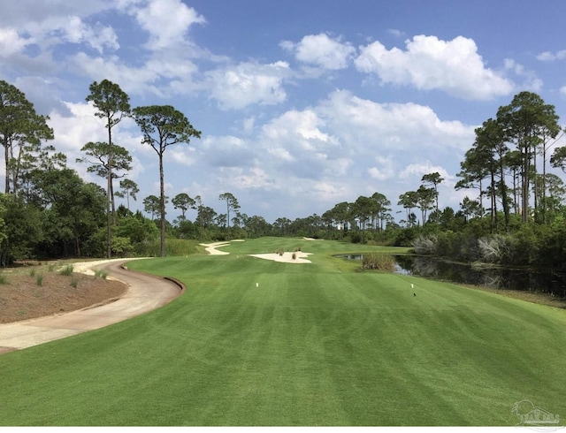 view of community featuring golf course view and a water view