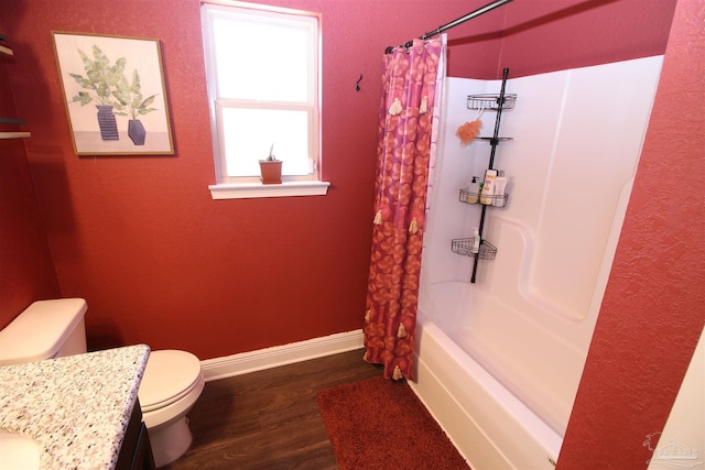 full bathroom with wood-type flooring, vanity, shower / tub combo, and toilet