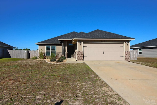 view of front facade featuring a front yard and a garage