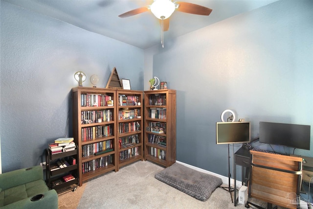 carpeted office with ceiling fan