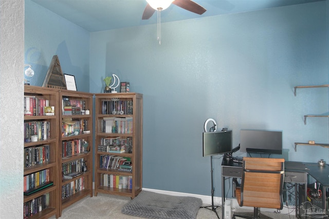 office space featuring carpet and ceiling fan