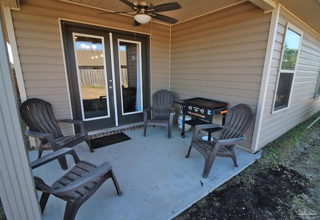 view of patio featuring ceiling fan