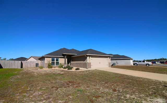 view of front facade featuring a front yard and a garage