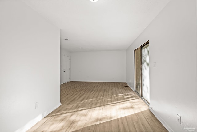 unfurnished room featuring light hardwood / wood-style floors