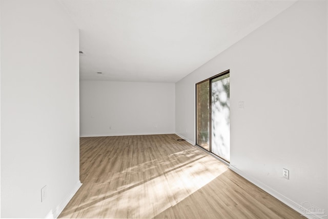 unfurnished room featuring light hardwood / wood-style flooring