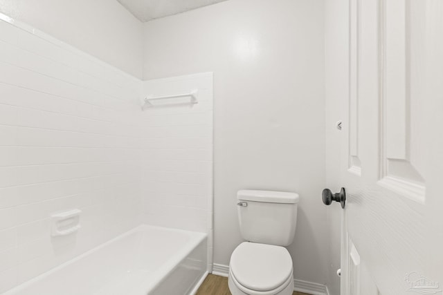 bathroom featuring hardwood / wood-style floors and toilet