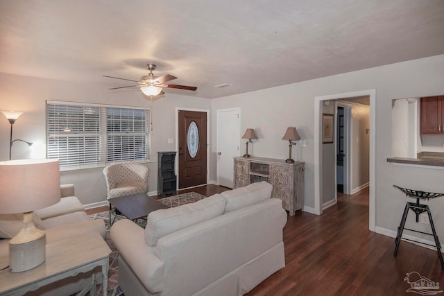 living room featuring dark hardwood / wood-style floors and ceiling fan