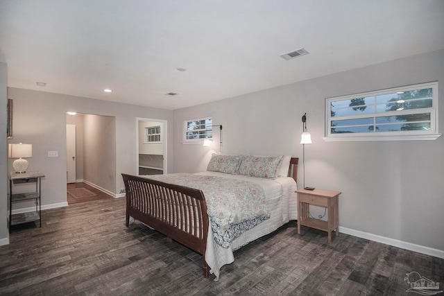 bedroom featuring dark hardwood / wood-style flooring