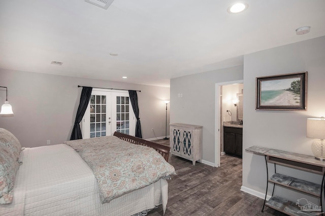 bedroom featuring french doors, connected bathroom, and dark hardwood / wood-style floors