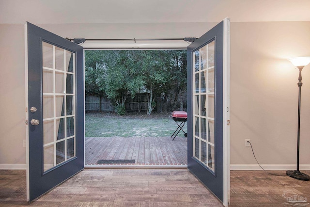 doorway to outside featuring wood-type flooring and french doors