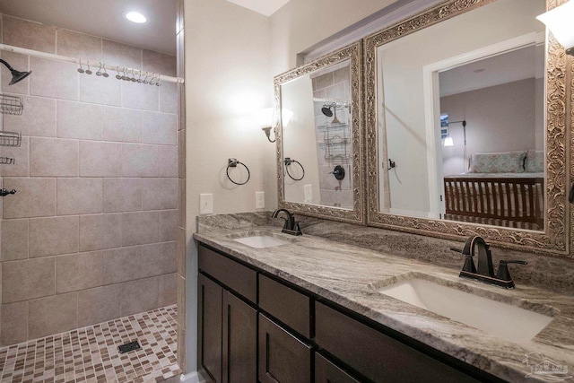 bathroom featuring vanity and a tile shower