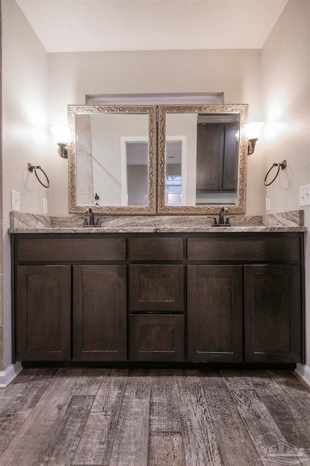 bathroom with vanity and hardwood / wood-style flooring