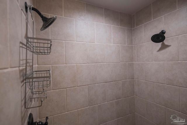 bathroom with tiled shower