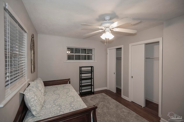 bedroom with ceiling fan and dark hardwood / wood-style floors