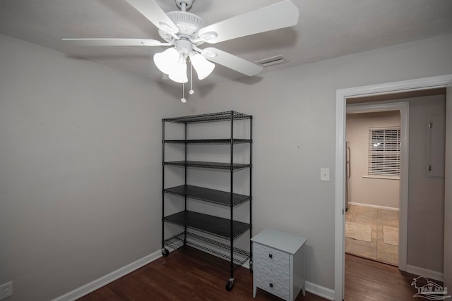 interior space with ceiling fan and dark wood-type flooring