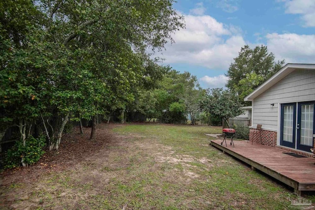 view of yard with a wooden deck