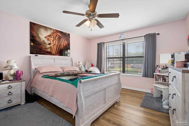 6819 Old W Ln, Milton, FL 32570 - bedroom featuring baseboards, light wood finished floors, and ceiling fan