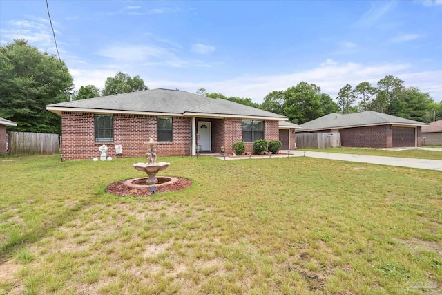 6819 Old W Ln, Milton, FL 32570 - ranch-style home with concrete driveway, a garage, and brick siding