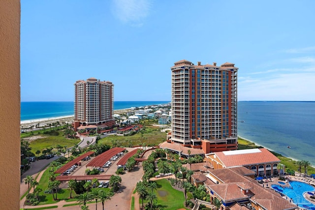 drone / aerial view with a beach view and a water view