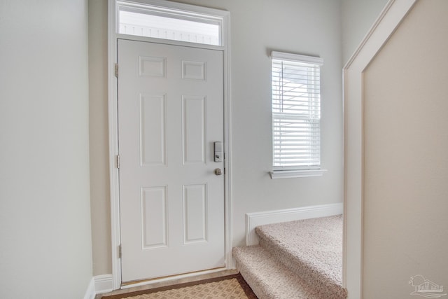 foyer entrance featuring plenty of natural light