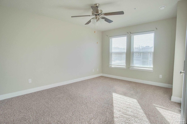 unfurnished room featuring carpet floors and ceiling fan