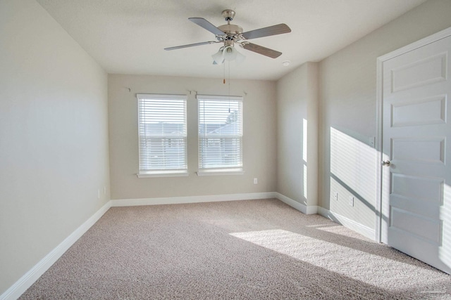 carpeted empty room with ceiling fan