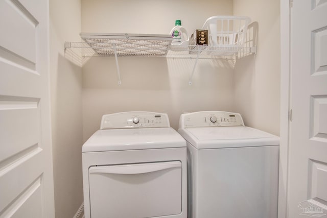 washroom featuring independent washer and dryer