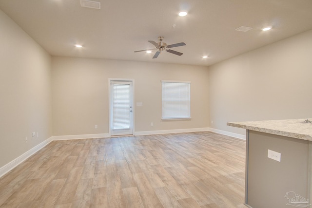 interior space featuring ceiling fan and light hardwood / wood-style floors