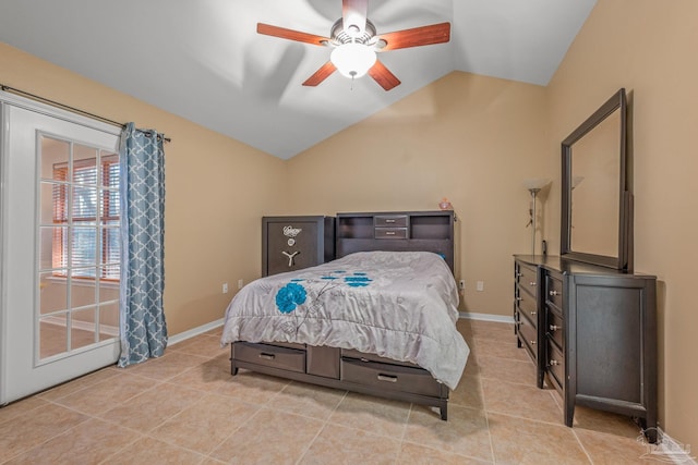 bedroom with lofted ceiling, light tile patterned flooring, ceiling fan, and baseboards