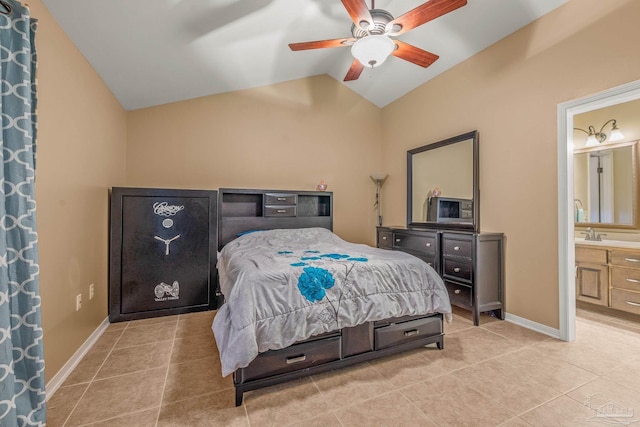 bedroom featuring lofted ceiling, light tile patterned flooring, and baseboards