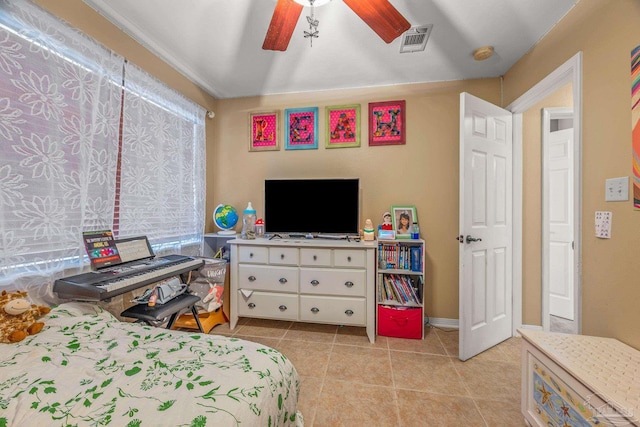 bedroom with light tile patterned floors, ceiling fan, and visible vents