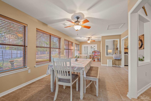 dining area featuring light tile patterned floors, baseboards, and visible vents