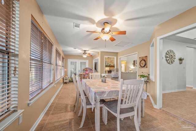 dining area featuring attic access, baseboards, visible vents, french doors, and light tile patterned flooring