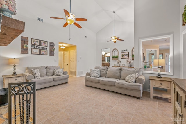 living area with light tile patterned floors, ceiling fan, and visible vents