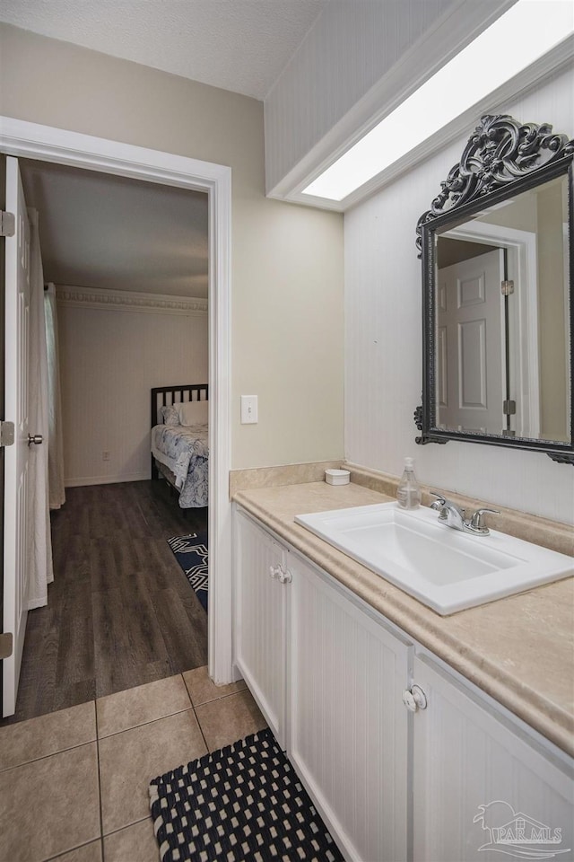 bathroom featuring vanity and tile patterned flooring