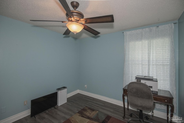 office space featuring ceiling fan, dark hardwood / wood-style flooring, and a textured ceiling