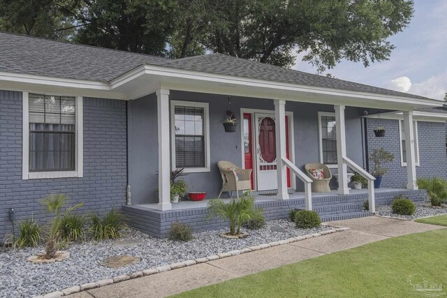 ranch-style home with a porch