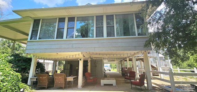 7649 River Rd, Milton, FL 32583 - rear view of house featuring a patio, fence, and stairs