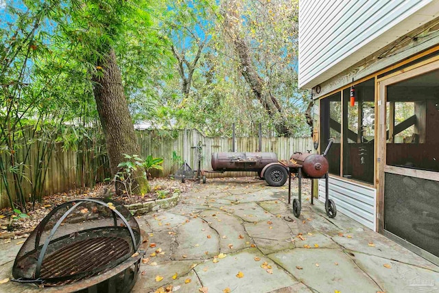 view of patio with a sunroom