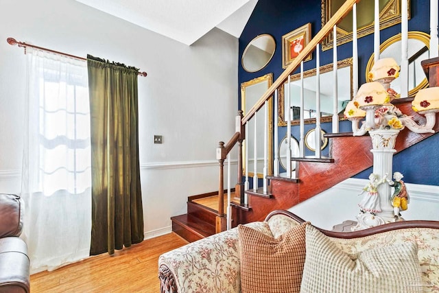 stairway with hardwood / wood-style flooring